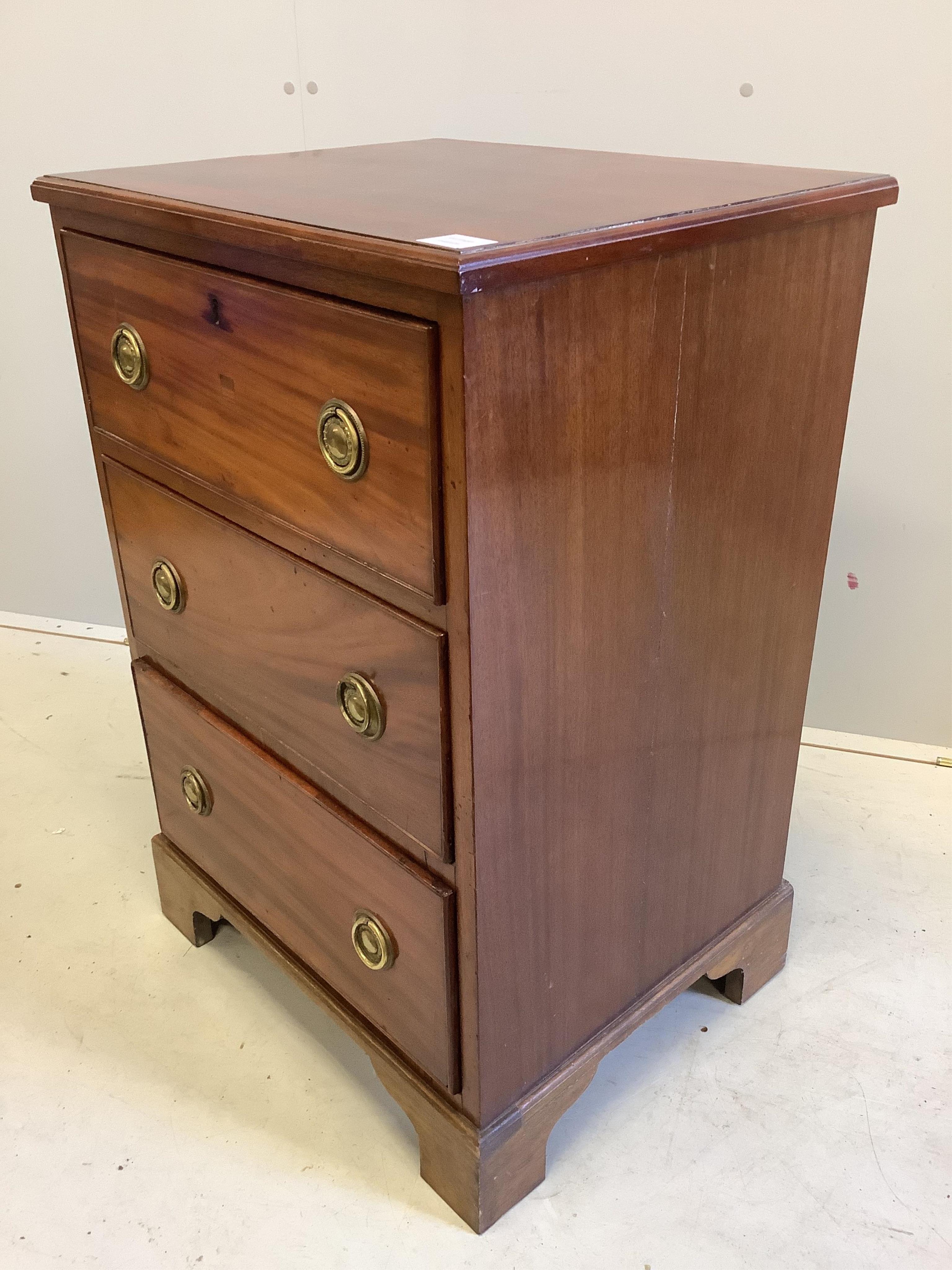 A George III style mahogany chest, fitted three long drawers, width 58cm, depth 47cm, height 85cm. Condition - fair